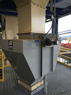 ndustrial grain hopper with motor, situated in a processing facility